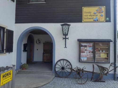a building with a bike parked outside of it at Wellness Pension Hubertus in Marquartstein