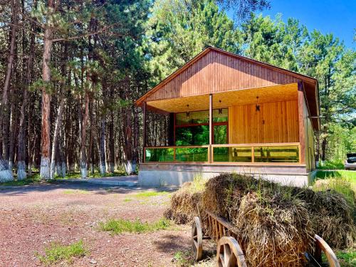 a small house with hay bales in front of it at Milenium magic villas on Sevan beach in Sevan