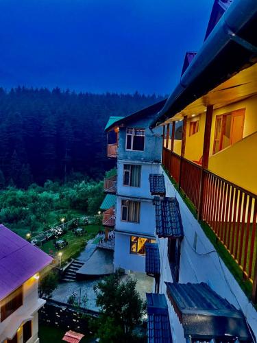 a view from the balcony of a building at Sparsh Resort, A Boutique Stay - Just 2kms uphill from Mall Road, near Old Manali in Manāli
