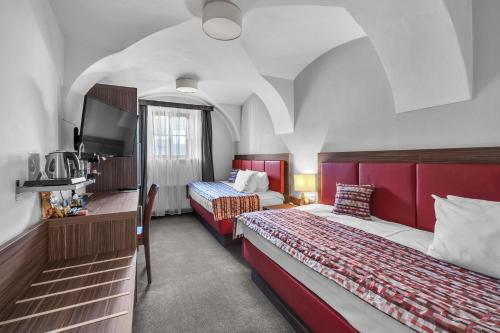 Postel nebo postele na pokoji v ubytování Hotel Nelly Kellys