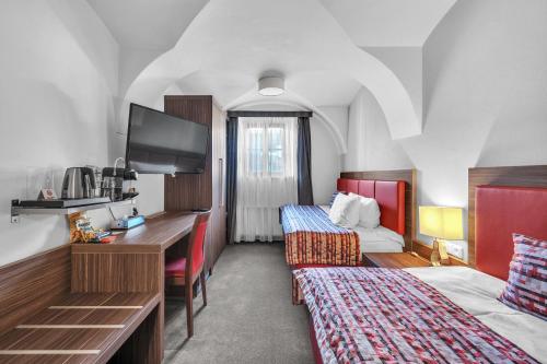 Una cama o camas en una habitación de Hotel Nelly Kellys