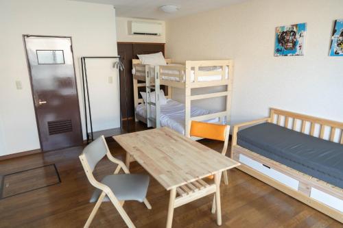 Katil atau katil-katil dalam bilik di Furano Zone Ski Condo 202喫煙可103禁煙
