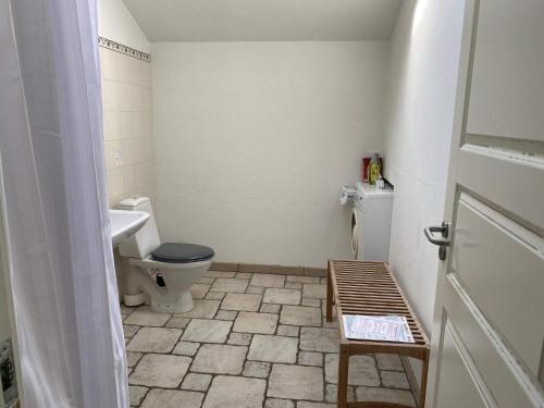 a bathroom with a toilet and a sink at Light-filled Retreat in Boddum - By Traum Ferienwohnungen in Boddum