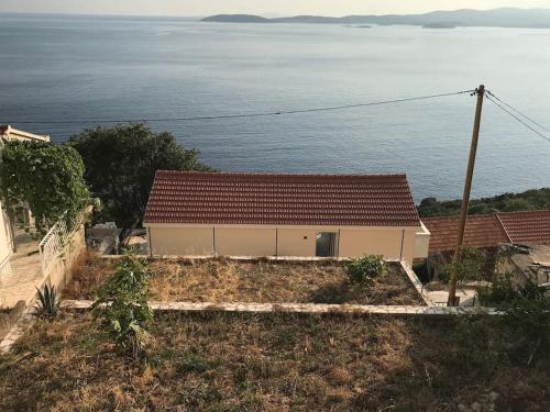 a house with a view of the ocean at Captain Branko in Orebić