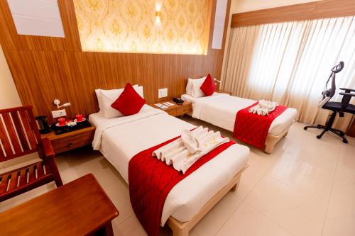 Postel nebo postele na pokoji v ubytování Hotel DSF Grand Plaza