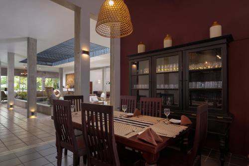 a dining room with a table and chairs at Lake Hideaway in Panadura