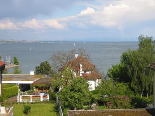a house with a view of the water at Gästehaus Holzer in Konstanz