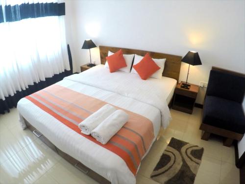 Una habitación en OnThree20 Araliya Apartment Colombo