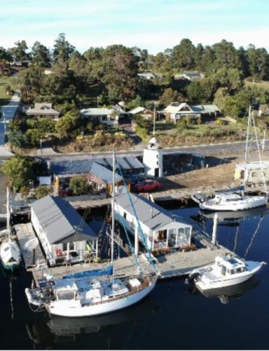 an aerial view of a marina with boats in the water at Elegant and scenic floating boat house in Kettering