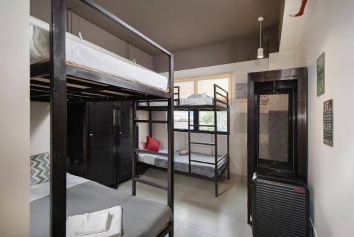 Postel nebo postele na pokoji v ubytování The Grid Co-Living Managed by HII