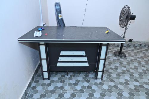 a ping pong table sitting on top of a floor at Privyrooms GORAKHPUR in Gorakhpur