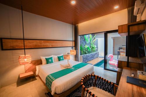Кровать или кровати в номере Ubu Villa Amara in North Yogyakarta