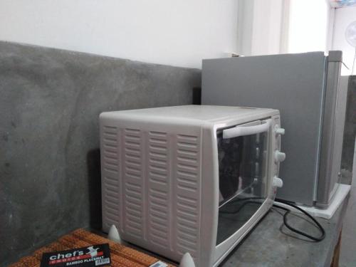 TV a/nebo společenská místnost v ubytování Parei Beach Inn