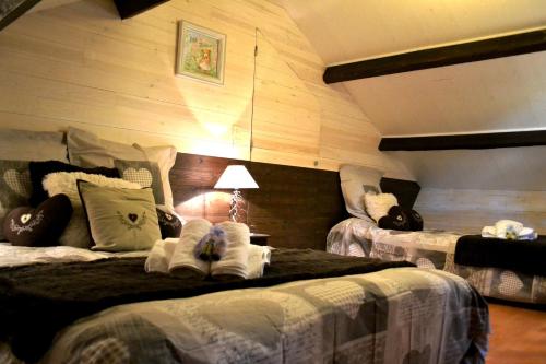 Katil atau katil-katil dalam bilik di Chalet L'Ecureuil