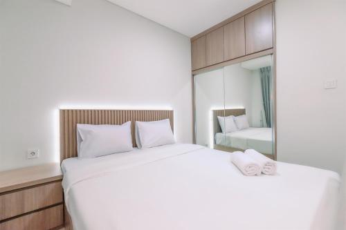 Ένα ή περισσότερα κρεβάτια σε δωμάτιο στο Relaxing Studio at Daan Mogot City Apartment By Travelio