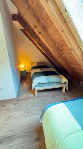 a bedroom with a bed in a attic at Juaniz in Tolmin