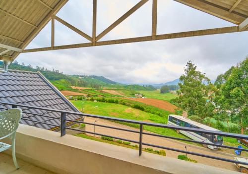 a balcony with a view of a mountain at AJ Gable Clouds Ooty by VOYE HOMES - Serene Stay Near Avalanche Emerald Lake in Ooty