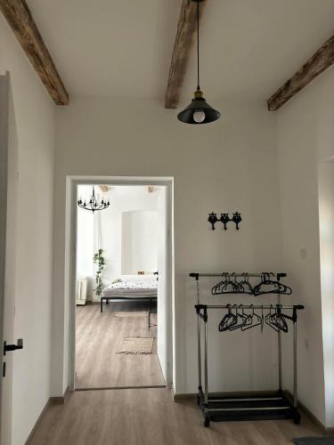 a room with a door leading to a bedroom at Relax Vendégház Tisza-tó in Poroszló