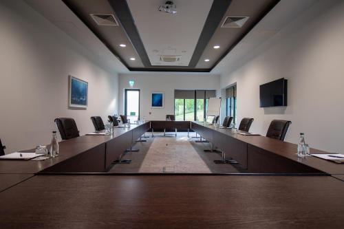 a large conference room with a long table and chairs at Fota Island Hotel and Spa in Fota Island
