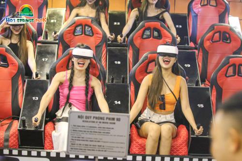 a group of girls sitting on seats in a roller coaster at Ebisu Onsen Resort in Ba Na
