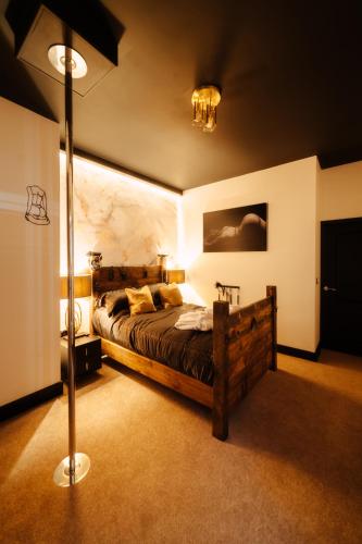 a bedroom with a large bed in a room at Casa Amor - Adult Only Jacuzzi Suite in Southampton