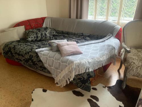 a couch with pillows on it in a living room at Villa Mariett in Kuressaare