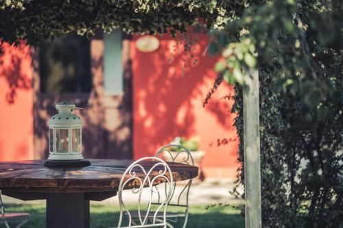 a lantern sitting on top of a wooden table at Country Resort Le Due Ruote in Alberese