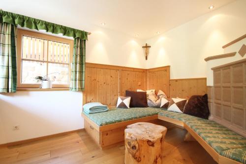 a living room with a couch and a table at Almliesl LOFE-727 in Lofer