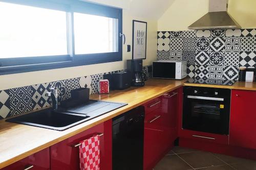 Kuchyň nebo kuchyňský kout v ubytování Le gîte de la Ferme