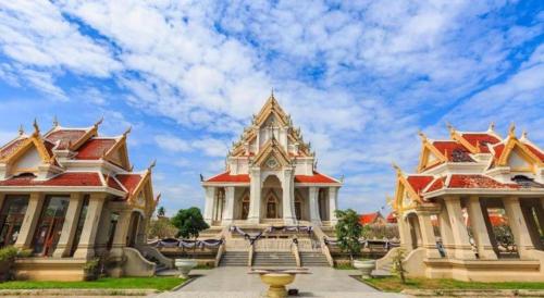 a group of buildings with red and white roofs at OYO 75314 Mountain Beach in Prachuap Khiri Khan