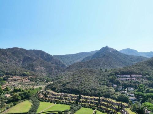 a view of a valley with mountains in the background at Sant'Anna Del Volterraio - Papaveri 7 in SantʼAnna