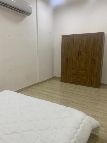 Katil atau katil-katil dalam bilik di Salma building - السعاده