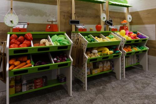 a produce section of a store with different types of fruits and vegetables at Glacier Premium Apartments in Bukovel