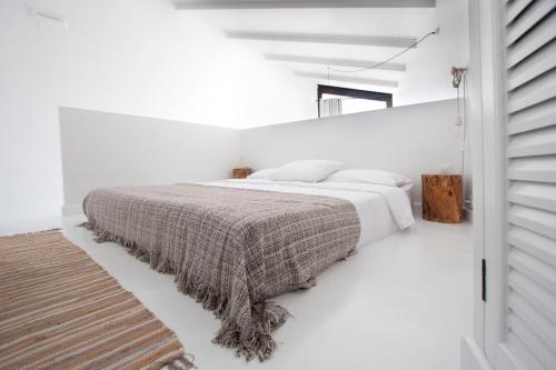 Кровать или кровати в номере Akassa Alojamientos Bioclimaticos en las Hurdes