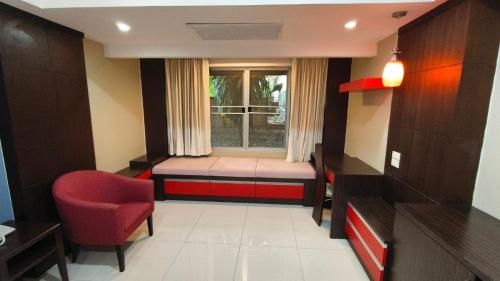 a small room with a bed and a window at Eastpana Executive Residence 304 Prachinburi in Si Maha Phot