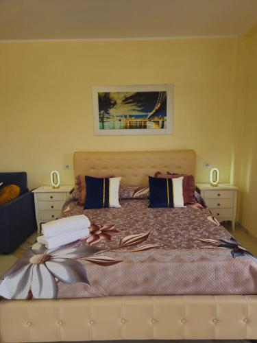 a bedroom with a large bed with two pillows at B&B Giardino Isabella in Palagiano