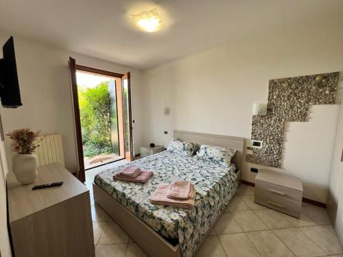 Ένα ή περισσότερα κρεβάτια σε δωμάτιο στο Al Riparo - Comfort near Verona