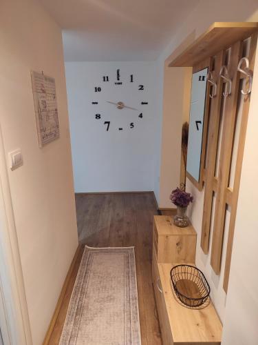 a room with a clock on the wall at Gornji Milanovac Apartment in Gornji Milanovac