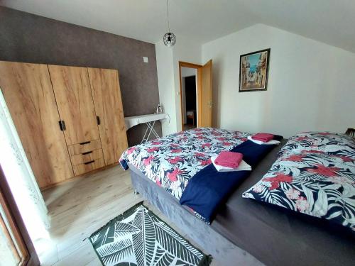 Llit o llits en una habitació de Apartman Rita