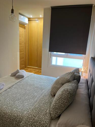 Katil atau katil-katil dalam bilik di Apartamento Nordés