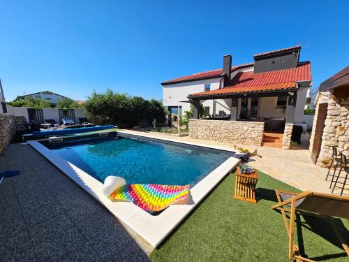 Villa Izziy by the beach with a sea view