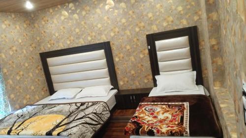 Postel nebo postele na pokoji v ubytování Damir Palace
