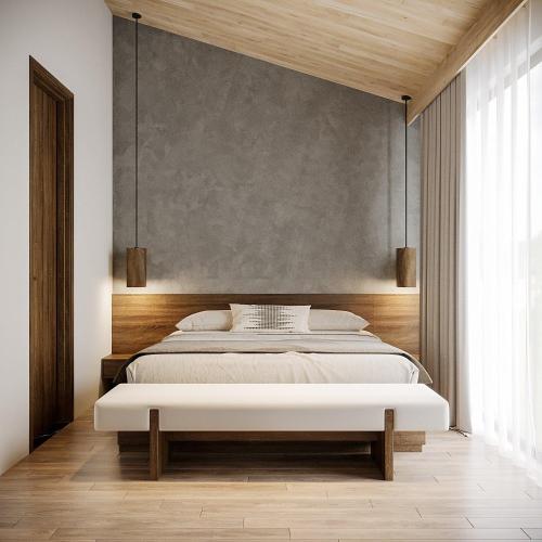 a bedroom with a large bed and a wall at Thung Nham Resort in Ninh Binh