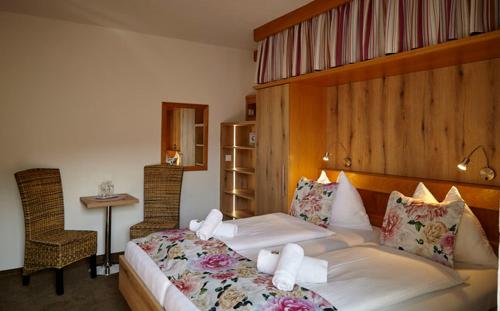 Postel nebo postele na pokoji v ubytování Pension Haus Aschgan