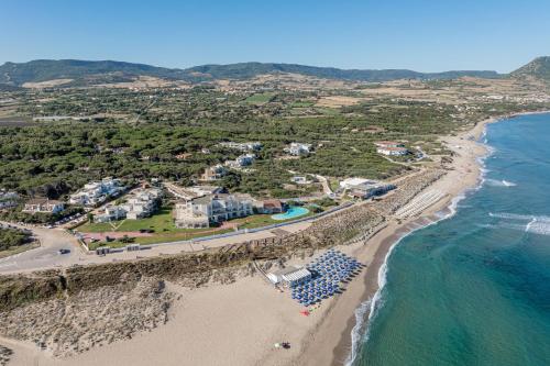 an aerial view of a beach with a resort at Bellevue Sardinia Resort Affiliated by Meliá in Valledoria