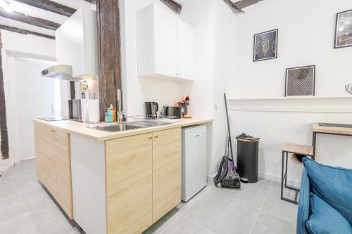 a kitchen with a sink and a counter top at La Cachette d'Amboise - Appart. 2 pers. in Amboise