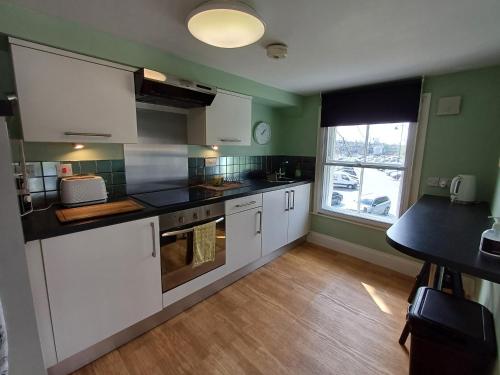 Kuchyň nebo kuchyňský kout v ubytování Abbotts Mews Apartment York City Centre