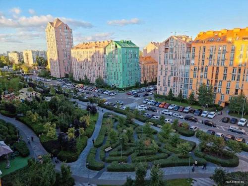 an aerial view of a city with buildings and a parking lot at Смарт квартира в ЖК Комфорт Таун in Kyiv