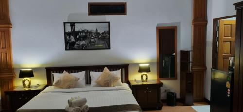a bedroom with a bed with a teddy bear on it at Meyers Hua Hin in Hua Hin