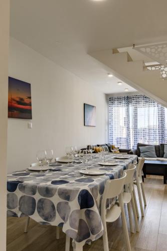 a dining room with a large table and chairs at Villa Miri III in Privlaka